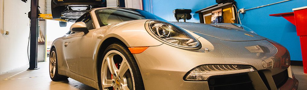 Side view of a silver porsche